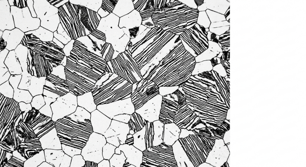 Microscopic view of AISI 1045 steel grain structure showing a balanced distribution of light ferrite and dark lamellar pearlite after normalizing.